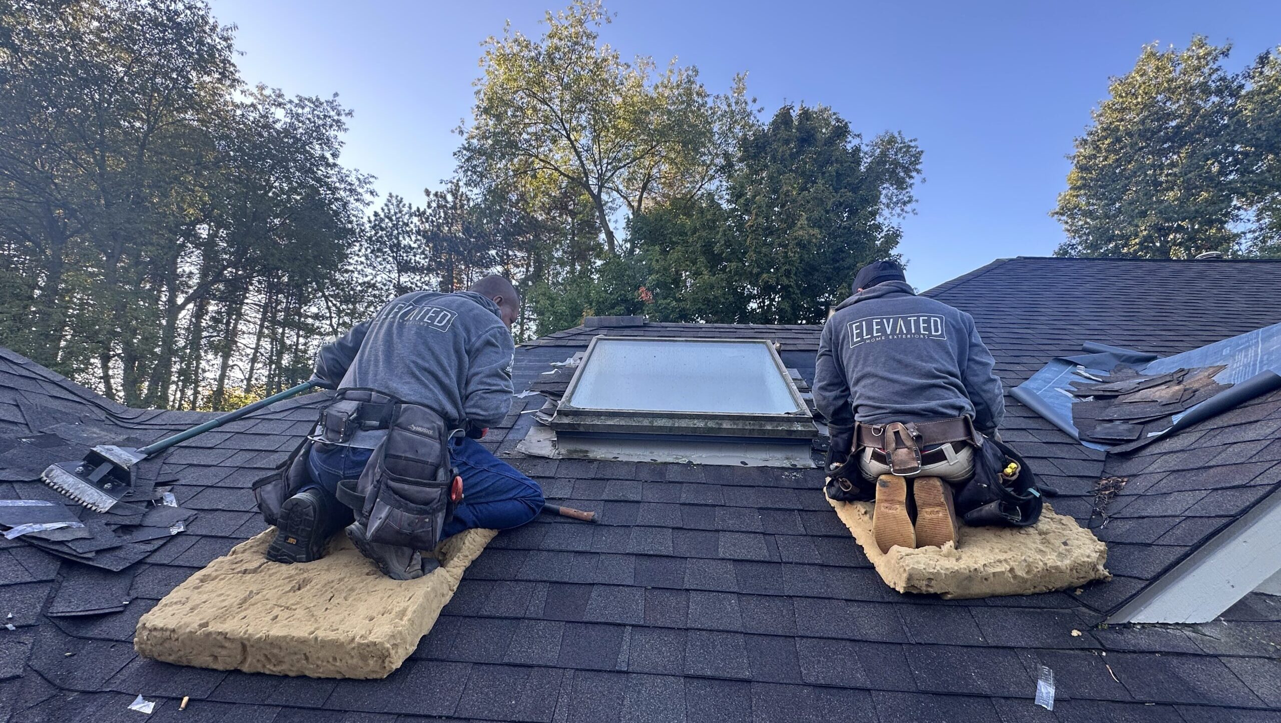 Elevated Home Exteriors Roof Worker